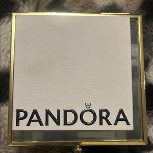 Pandora silver bracelet with heart shaped clash and stars.